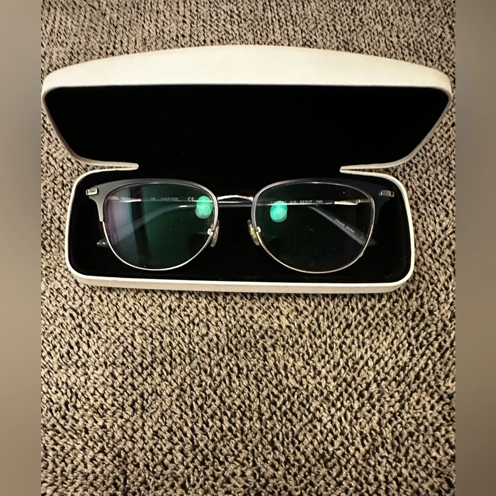 Calvin Klein youth eyeglasses and case.